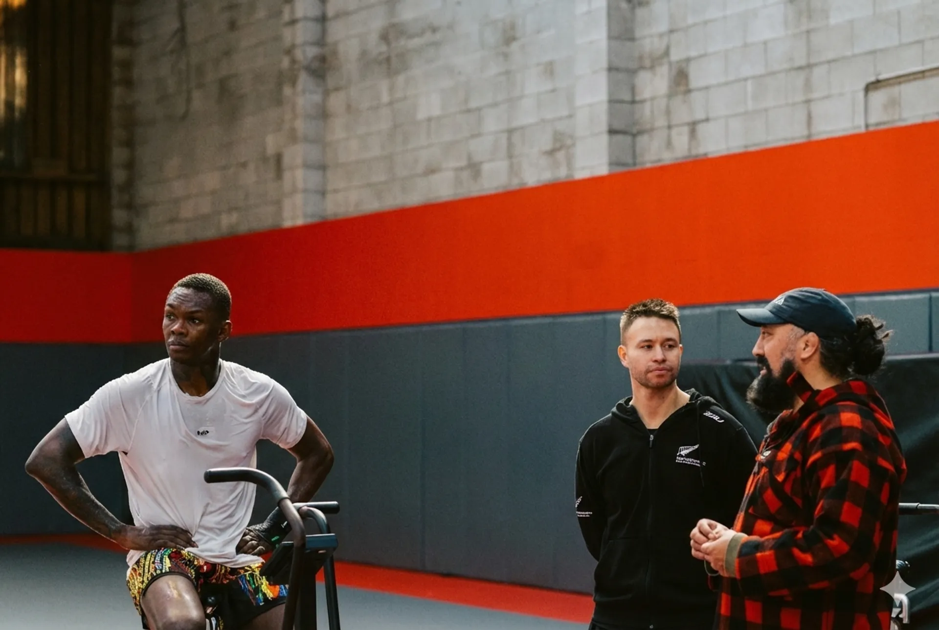 Bill Smart with Israel Adesanya and head coach Eugene Bareman at City Kickboxing